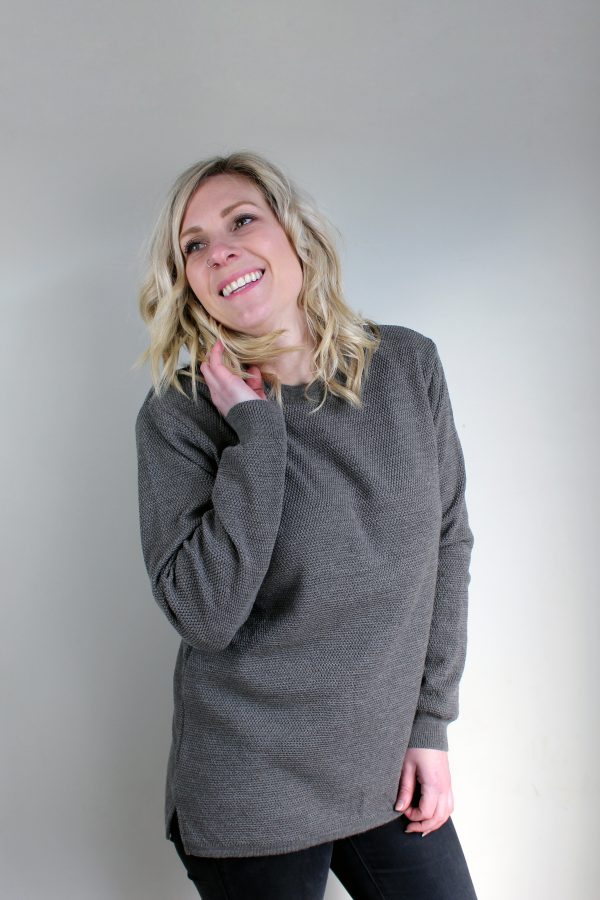 A lady wearing an Australian Made, Ballarat Gold merino wool moss crew jumper in Mocha Brown