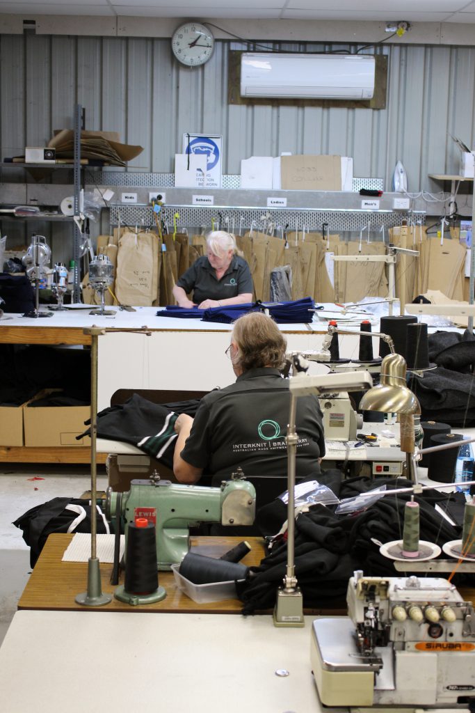 Interknit Branberry's Australian manufacturing factory with workers engaged in sewing and cutting processes