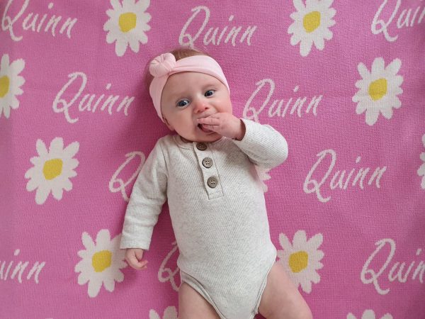 Taffy Pink Personalised Wool Name Blanket - Adorable baby laid on the softness. Crafted from Pure Australian Merino Wool, proudly Made in Australia.
