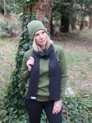 A lady wearing an Australian Made, Plain Adult Unisex Scarf in Bond Grey, made from Pure Australian Merino Wool