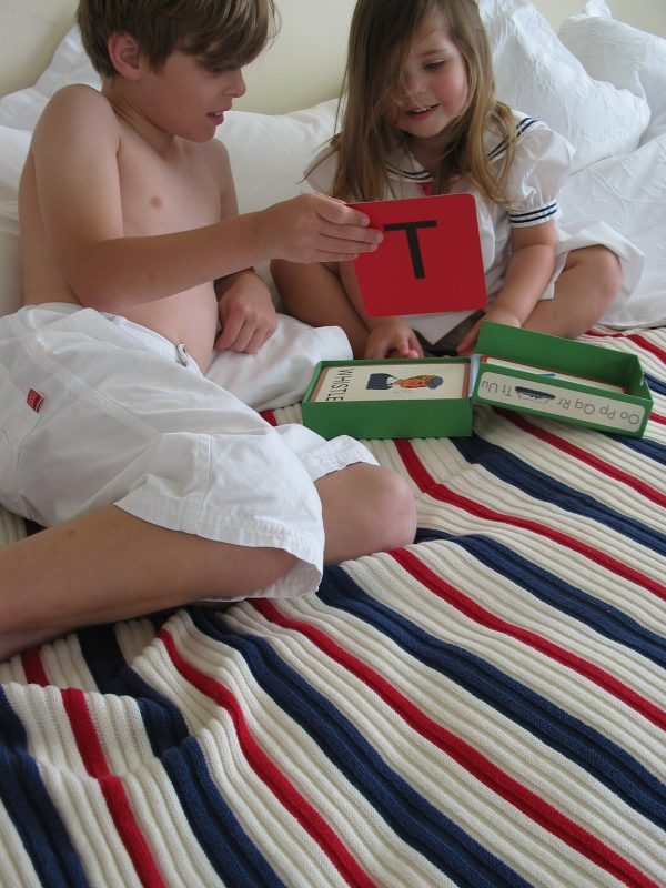 Children playing on Navy, Red & White Striped Garter Stitch Blanket